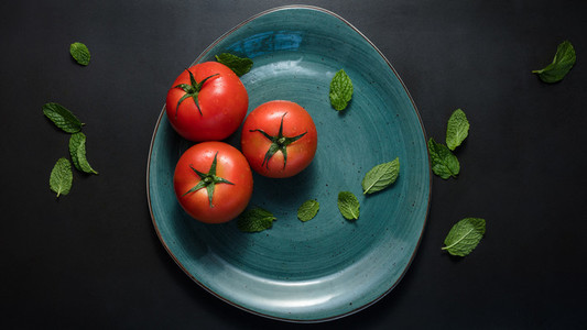 Tomatoes and mint in a plate