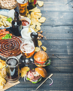 Octoberfest beer and snacks set on dark background copy space