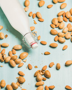 Dairy alternative almond milk in bottle  allergy friendly food concept