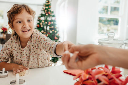 Little girl making cookies for Christmas