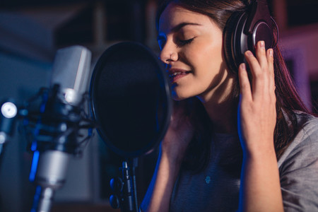 Female singer in recording studio