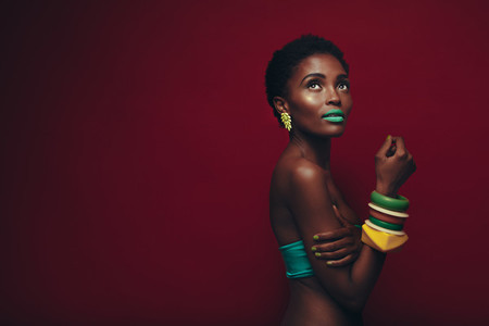 Attractive young african woman with vibrant makeup