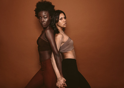 Two diverse woman standing together