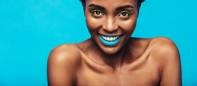 Beautiful smiling woman with vibrant makeup