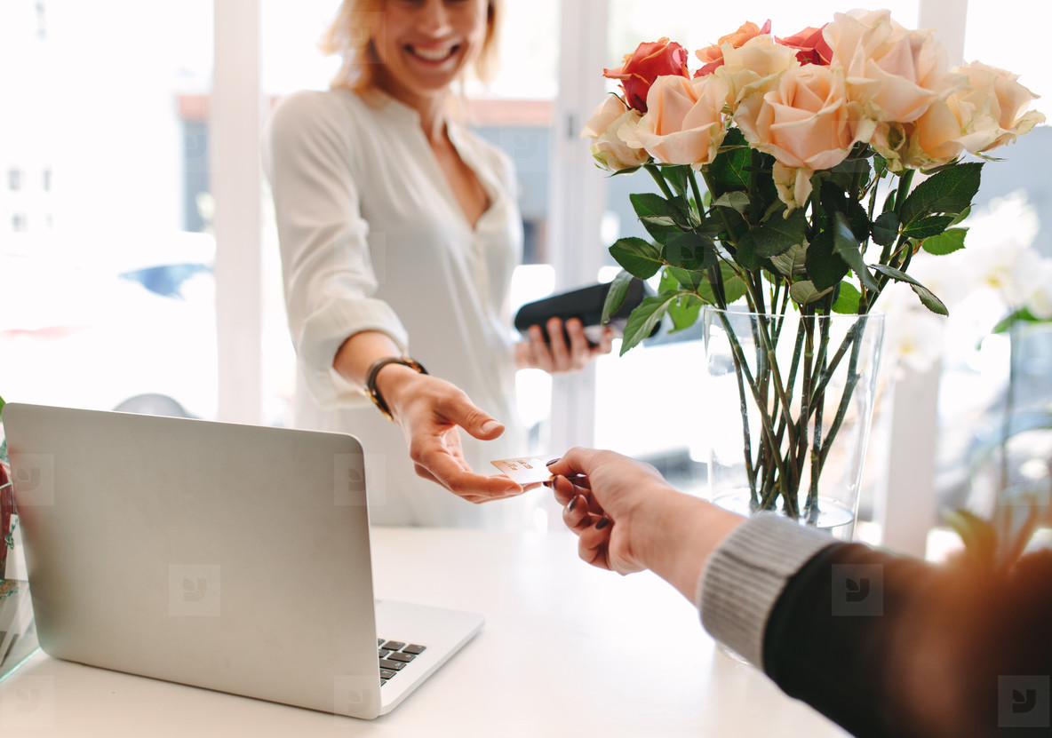 Client paying for flowers with debit card