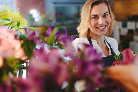 Smiling florist working in her shop