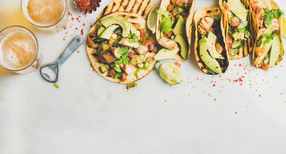 Healthy corn tortillas with grilled chicken avocado lime beer