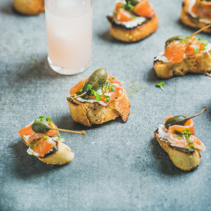 Crostini with smoked salmon and grapefruit cocktails  square crop