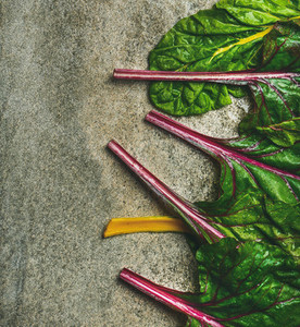Flat lay of fresh leaves of swiss chard  vertical composition