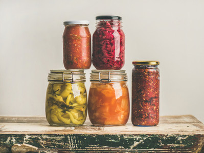 Autumn seasonal pickled or fermented colorful vegetables in glass jars