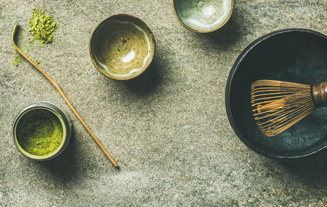 Japanese tools for brewing matcha tea  grey background  copy space