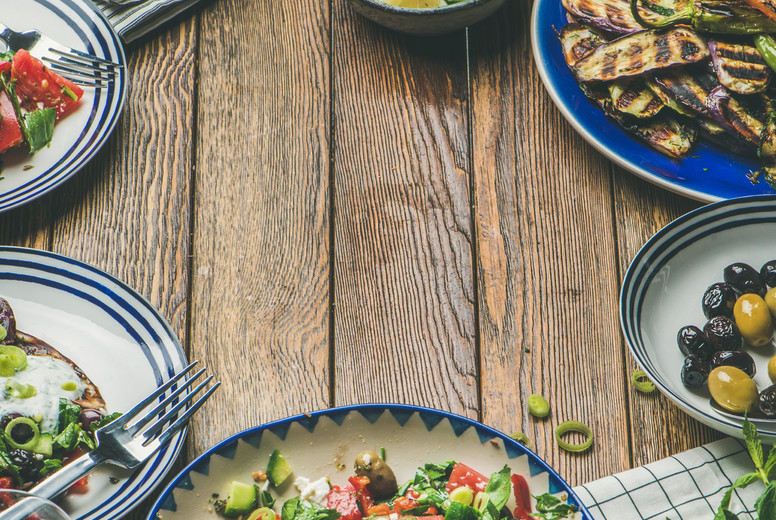Healthy vegetarian dinner table setting, copy space