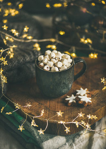 Christmas winter hot chocolate with marshmallows in dark mug