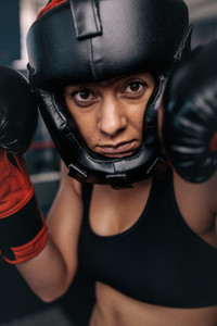Female boxer geared up for a bout