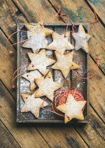 Christmas gingerbread cookies with sugar powder and decoration rope