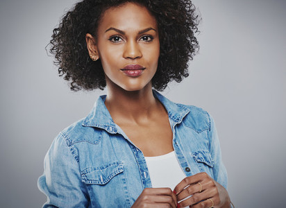 Serene woman with blue jean shirt and white top