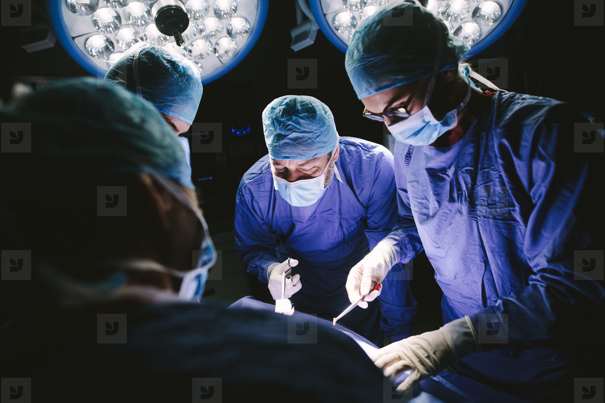 Team of professional surgeons performing surgery