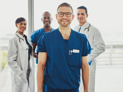 Relaxed confident doctor leading medical team