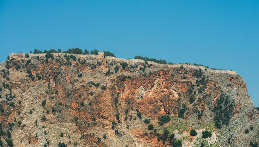 Rocks of Cilvarda cape and fortess wall of Alanya castle