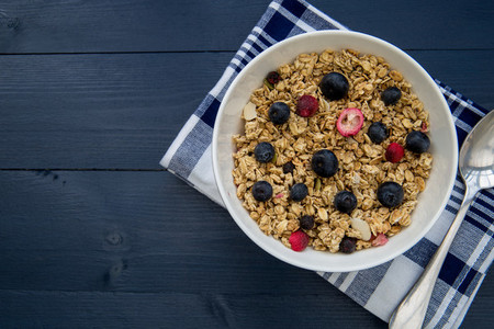 Healthy breakfast cereal bowl with spoon with copy space