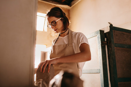 Female potter working with clay