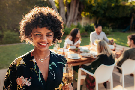 Smiling woman at outdoor party