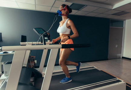 Female runner on treadmill at biomechanics lab