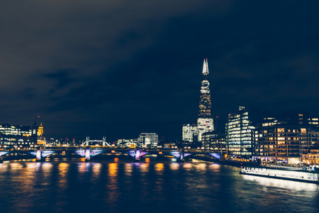 Long exposure shot at night on River Thames with shard building