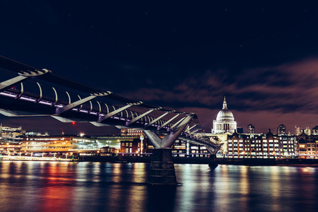 Long exposure of Millennium Bridge and London city skyline on Ri