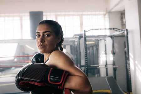 Female boxer training inside a boxing ring