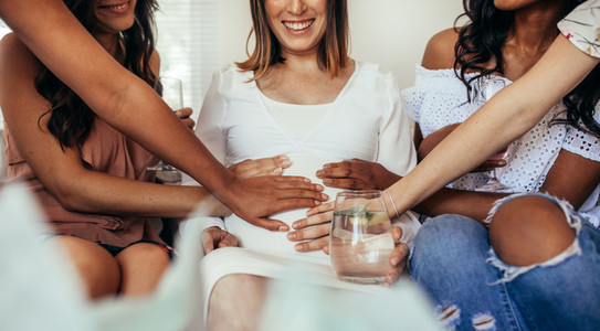 Friends sharing positivity and care for pregnancy