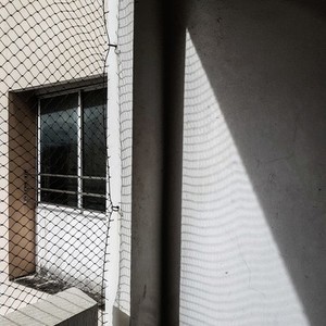 Net shadow on wall