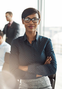 Female business executive with folded arms