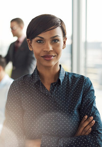 Confident young business woman in office