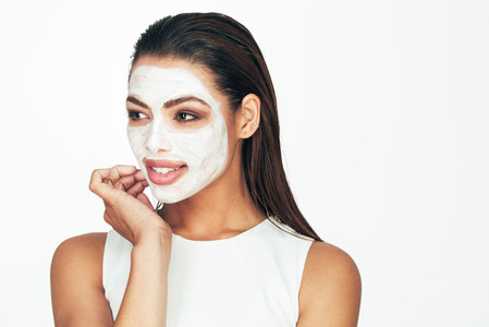 Woman with a cosmetic facial mask