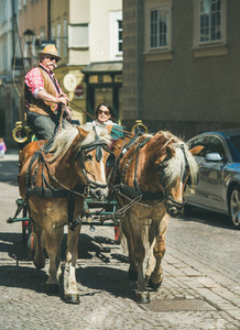 SALZBURG AUSTRIA   APRIL 09 2017 Horses pulling traditional Fiacre carriage
