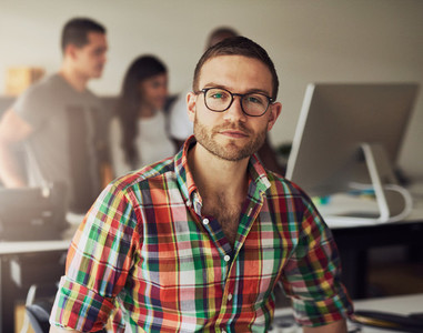 Young businessman wearing glasses in the office