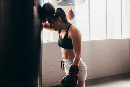 Female boxer training at a boxing studio