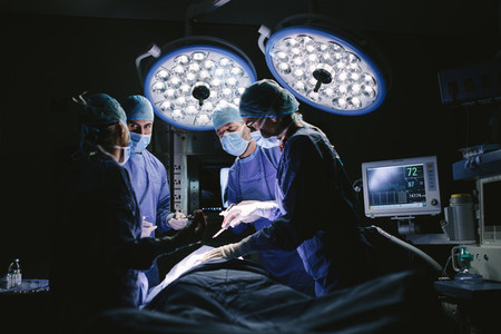 Medical team performing surgery in hospital