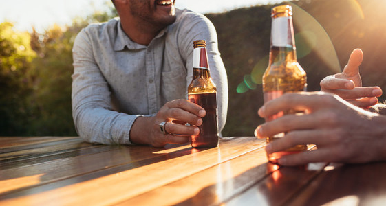 Couple having beers at outdoor party