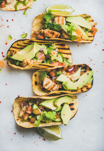 Healthy corn tortillas with grilled chicken avocado and fresh salsa