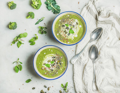 Spring healthy broccoli cream soup with mint and coconut cream