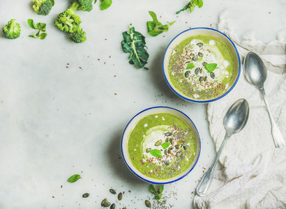 Broccoli cream soup with mint and coconut cream  copy space