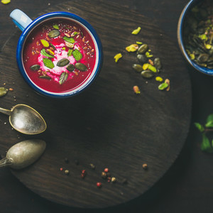 Dieting beetroot soup with mint pistachio and seeds copy space