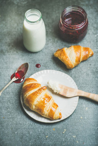 Croissants with raspberry jam  ricotta cheese and milk
