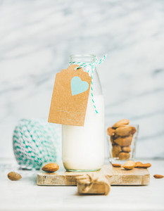 Fresh vegan dairy free almond milk with craft paper label