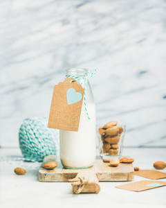 Fresh vegetarian dairy free almond milk with craft paper label