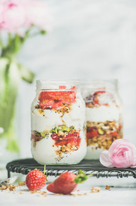 Greek yogurt granola fresh strawberry breakfast jars pink raninkulus flowers