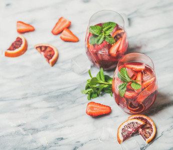 Fruit refreshing Sangria cocktails with ice and fresh mint