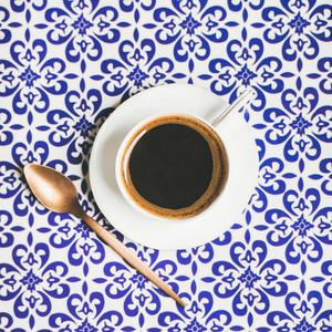 Cup of black Turkish or Eastern style coffee square crop